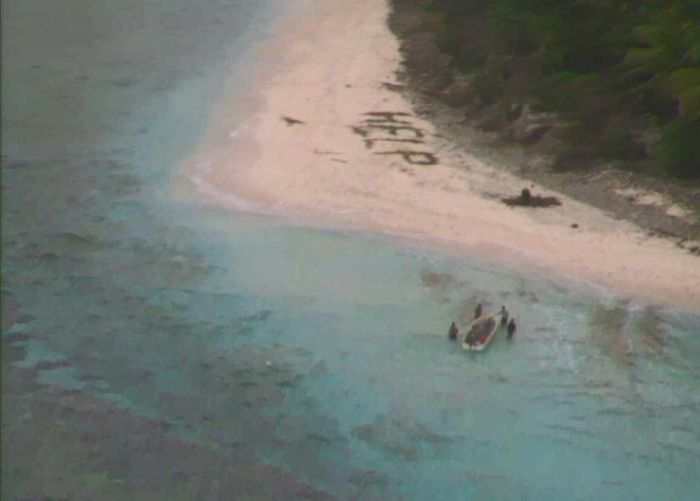 Castaways Get Rescued After Making A Help Sign In The Sand (4 pics)