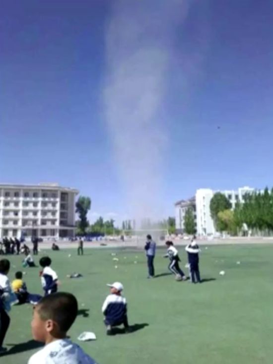 Chinese Boy Gets Sucked Up By Dust Devil Twister (4 pics + video)