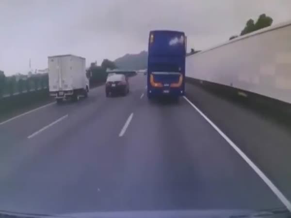 Bus Driver Loses Control After Trying To Pass Cars