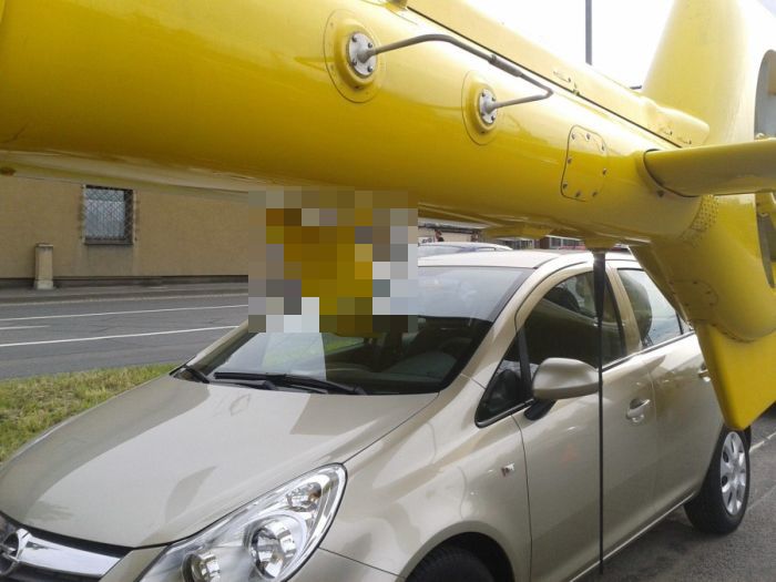 Helicopter Lands Directly In A Car's Windshield (3 pics)