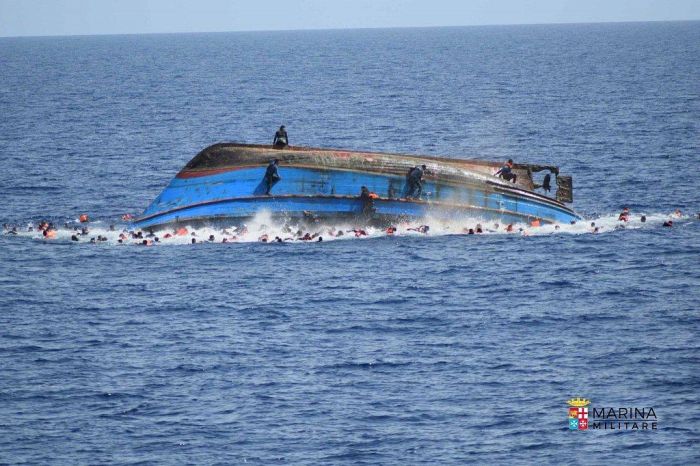 Italian Navy Rescues Migrants After Their Boat Reaches A Tipping Point (8 pics)