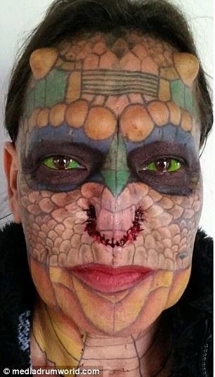 Former Bank Employee Modifies Their Body To Look More Like A Dragon (11 pics)