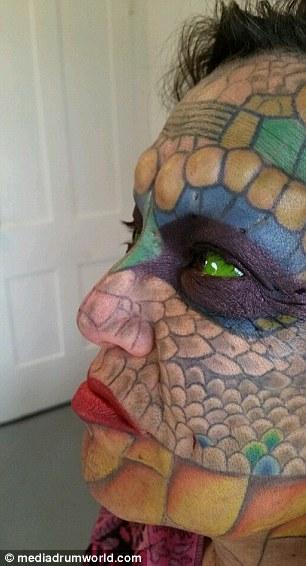 Former Bank Employee Modifies Their Body To Look More Like A Dragon (11 pics)