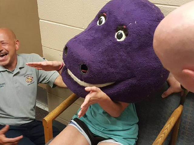 Young Girl Gets Stuck In A Barney The Purple Dinosaur Costume (7 pics)