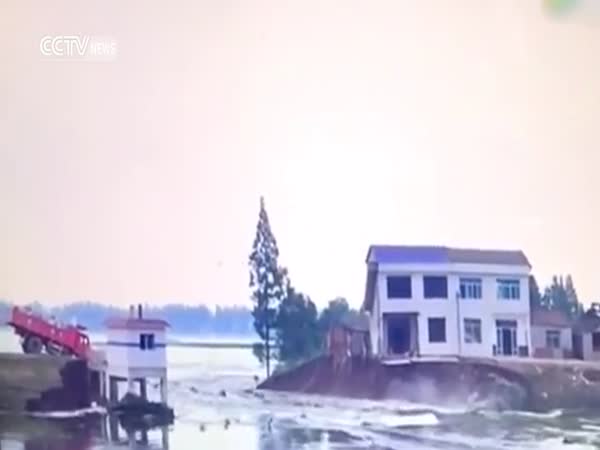 Fearles Driver Plunges Truck Full Of Rocks Into Floodwaters To Stem Breached Levee