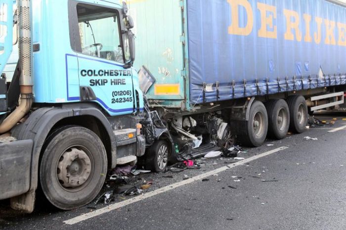 Driver Somehow Survives After Being Crushed Between Two Trucks (5 pics)