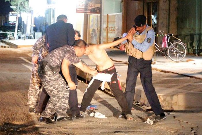 Police Remove Suicide Vest From Distressed Young Boy In Iraq (5 pics)