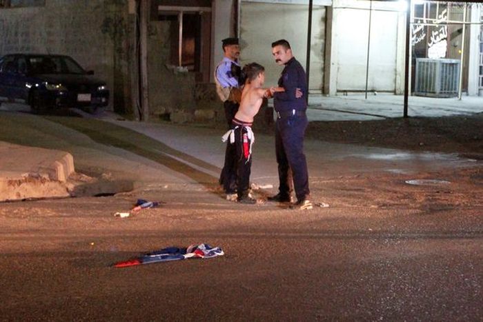 Police Remove Suicide Vest From Distressed Young Boy In Iraq (5 pics)