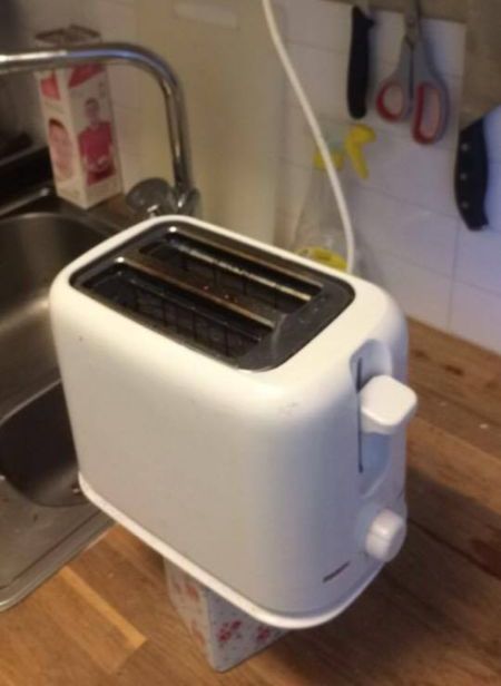 The Toaster Cord Was Too Short So They Made A Stand (2 pics)