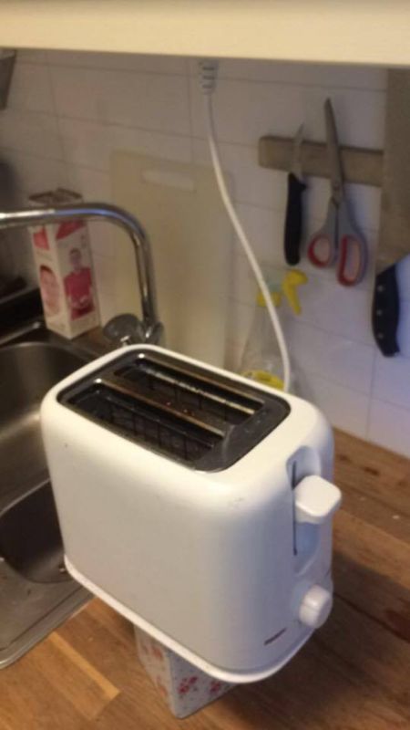The Toaster Cord Was Too Short So They Made A Stand (2 pics)