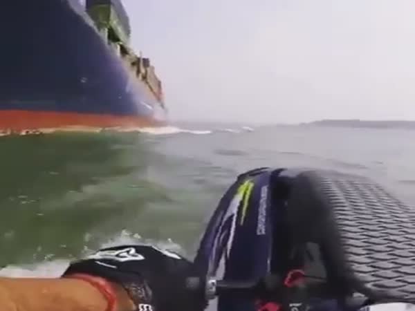 Jet Skier Almost Gets Sucked Under Container Ship