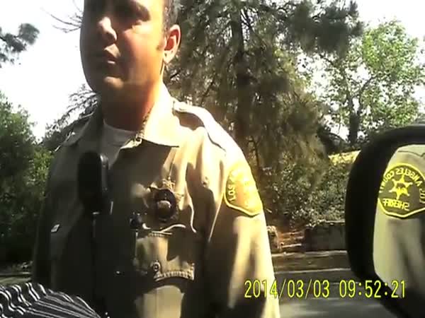 Shaky Cop Nervously Holds Private Investigator At Gunpoint