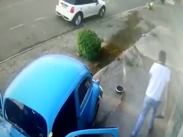 Man Escapes Death By Leaping Over An Out Of Control Car At The Last Second
