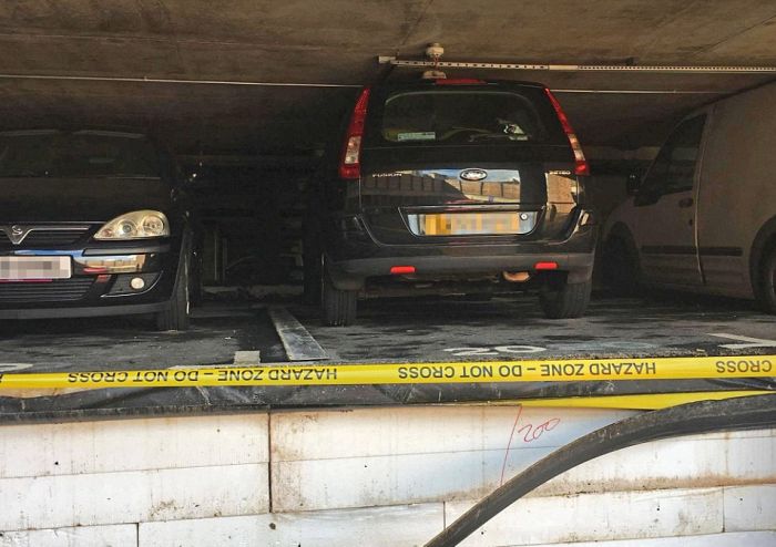 Cars Get Crushed After Pipe Bursts In Parking Garage (4 pics)