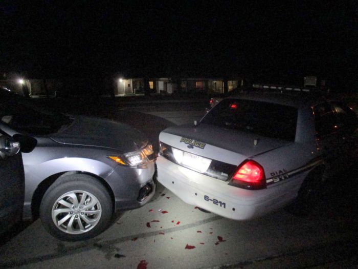 Student Crashes Into Police Car While Taking Topless Snapchat Pic (3 pics)