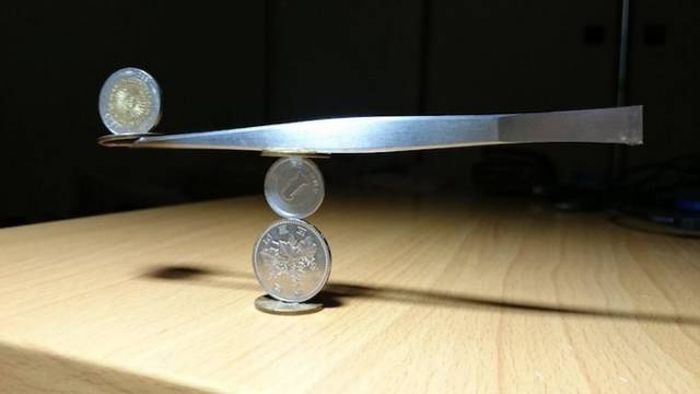  Japanese Guy Takes Coin Stacking To The Extreme (12 pics)