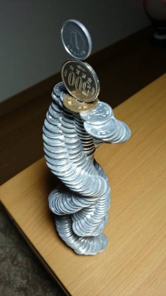  Japanese Guy Takes Coin Stacking To The Extreme (12 pics)
