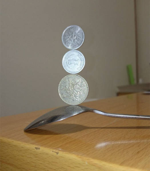  Japanese Guy Takes Coin Stacking To The Extreme (12 pics)