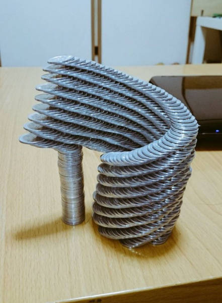  Japanese Guy Takes Coin Stacking To The Extreme (12 pics)
