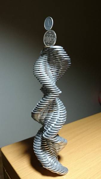  Japanese Guy Takes Coin Stacking To The Extreme (12 pics)