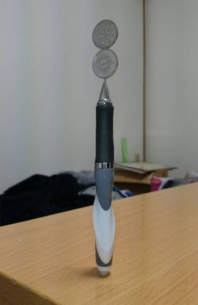  Japanese Guy Takes Coin Stacking To The Extreme (12 pics)
