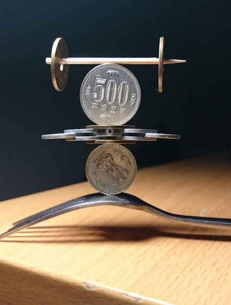  Japanese Guy Takes Coin Stacking To The Extreme (12 pics)