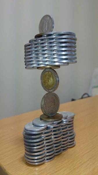  Japanese Guy Takes Coin Stacking To The Extreme (12 pics)