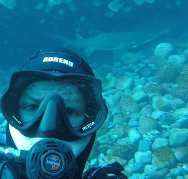 This Guy Just Loves To Play With Sharks (8 pics)