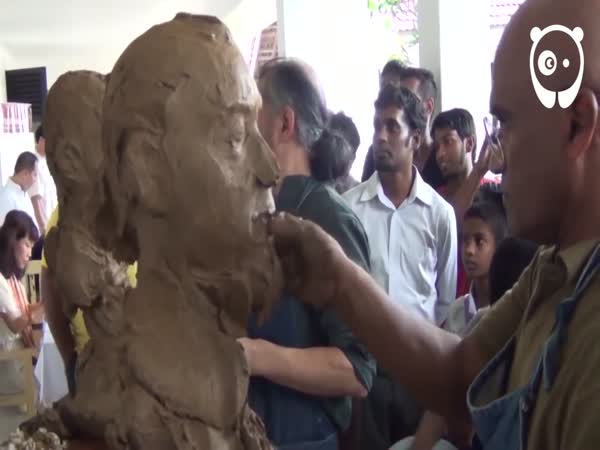 Two Artists Sculpting Each Other