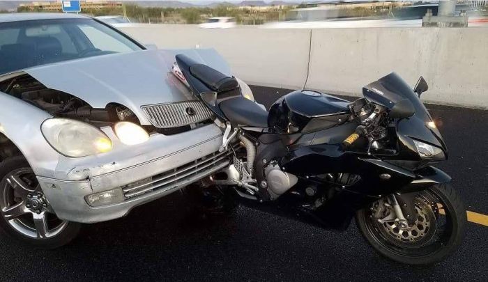 Car Takes On A Motorcycle And Loses (3 pics)