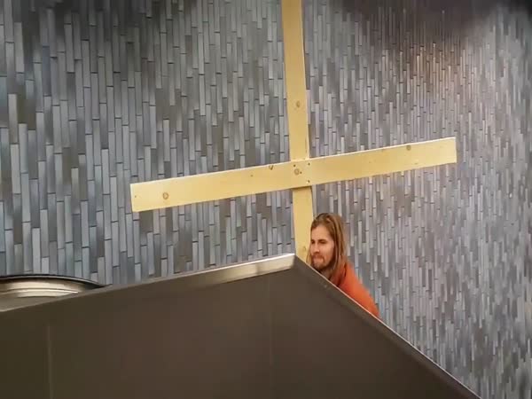 Jesus Gets His Cross Stuck In Underground Station Roof As He Travels Up The Es