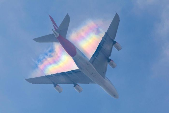 Plane Leaves A Stunning Rainbow Trail In The Sky (4 pics)
