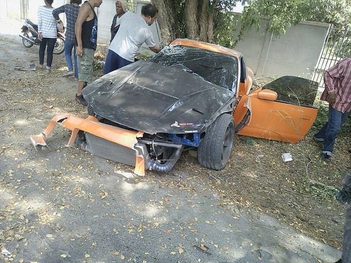 Buddhist Clergyman Wraps Sports Car Around A Tree (5 pics)