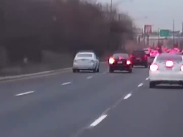 Driver Changing Lanes Gets Instant Karma