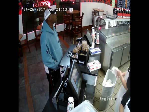 Calm Cashier Keeps His Cool As Armed Robber Threatens Him With Gun