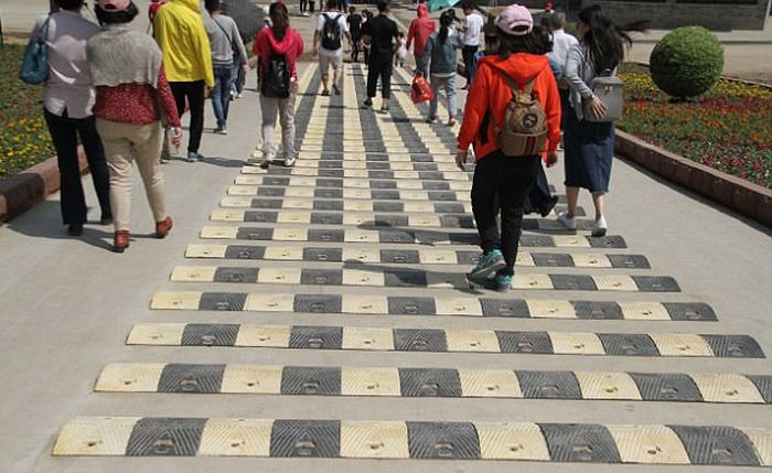 Chinese Tourist Attraction Adds Ridiculous Speed Bumps For Pedestrians (5 pics)