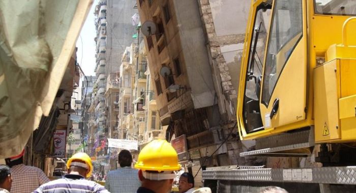 High Rise Building Falls Into A House In Egypt (6 pics)