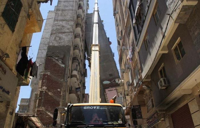 High Rise Building Falls Into A House In Egypt (6 pics)