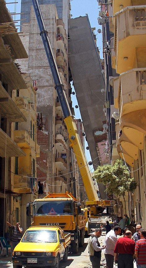 High Rise Building Falls Into A House In Egypt (6 pics)