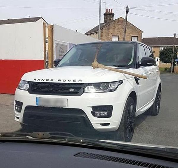 Disgruntled Employee Takes A Pickaxe To Boss' Range Rover (2 pics)