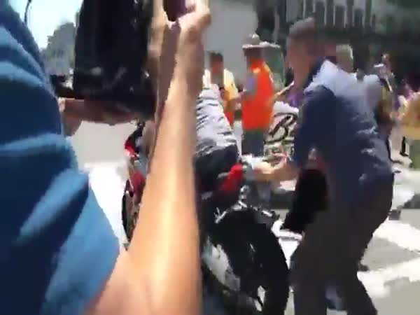 Motorcyclist Drives Through Protestors Laying In The Street