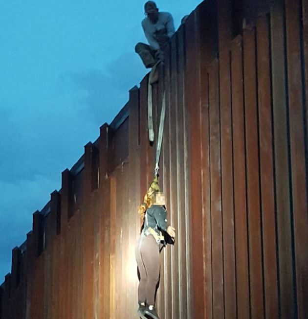 Mexican Woman Rescued After Left Dangling On The Border Wall (2 pics)