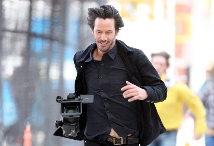 Keanu Reeves Runs Away With Stolen Paparazzi Camera (4 pics)
