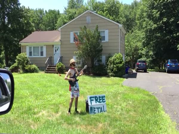 Guy With a Guitar And a Sign That Says 'Free Metal' Delivers On That Promise