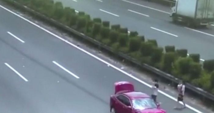 Couple Holding Baby Almost Get Killed By Oncoming Car (5 pics)