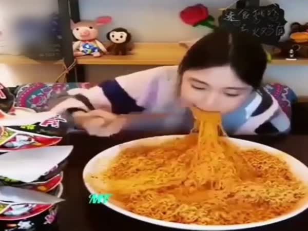 Asian Girl Eats Noodles