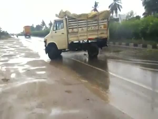 Truck Loses Control on Wet Road
