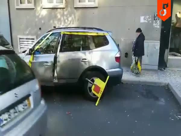 Driver Removes A Parking Wheel Lock Without The Key