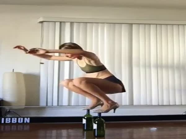Girl Shows Of Amazing Bottles Balancing Trick