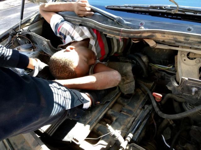 Migrants Hiding Underneath A Car's Bonnet And Seats (2 pics)